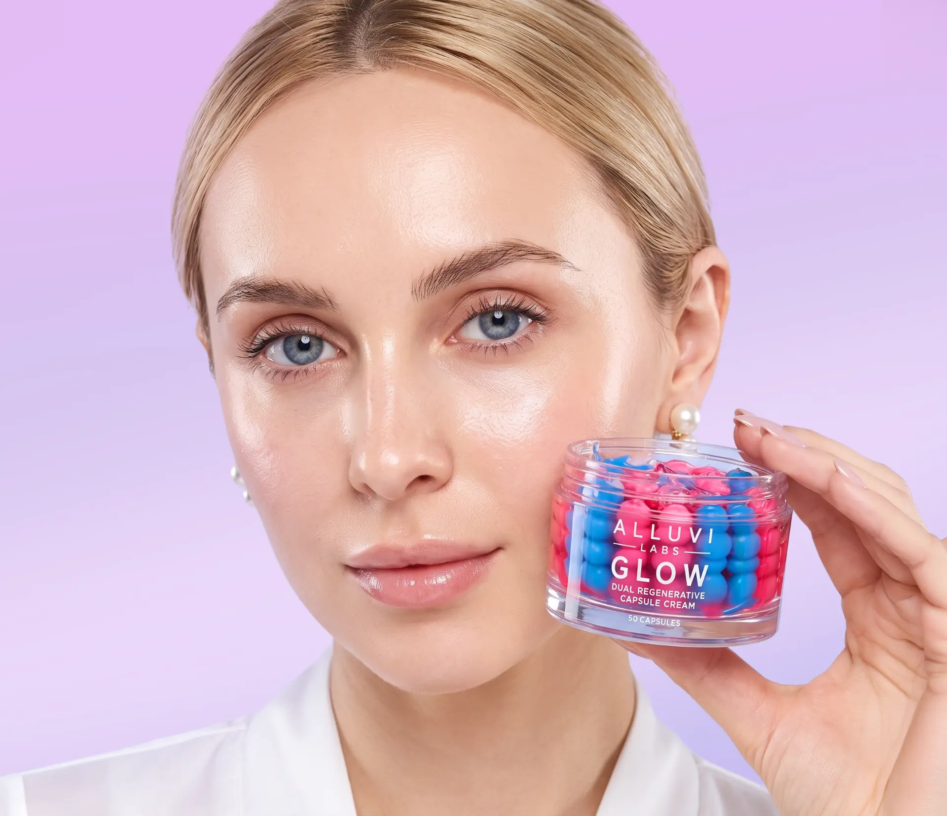 Model holding the GLOW Dual Regenerative Capsule Cream jar